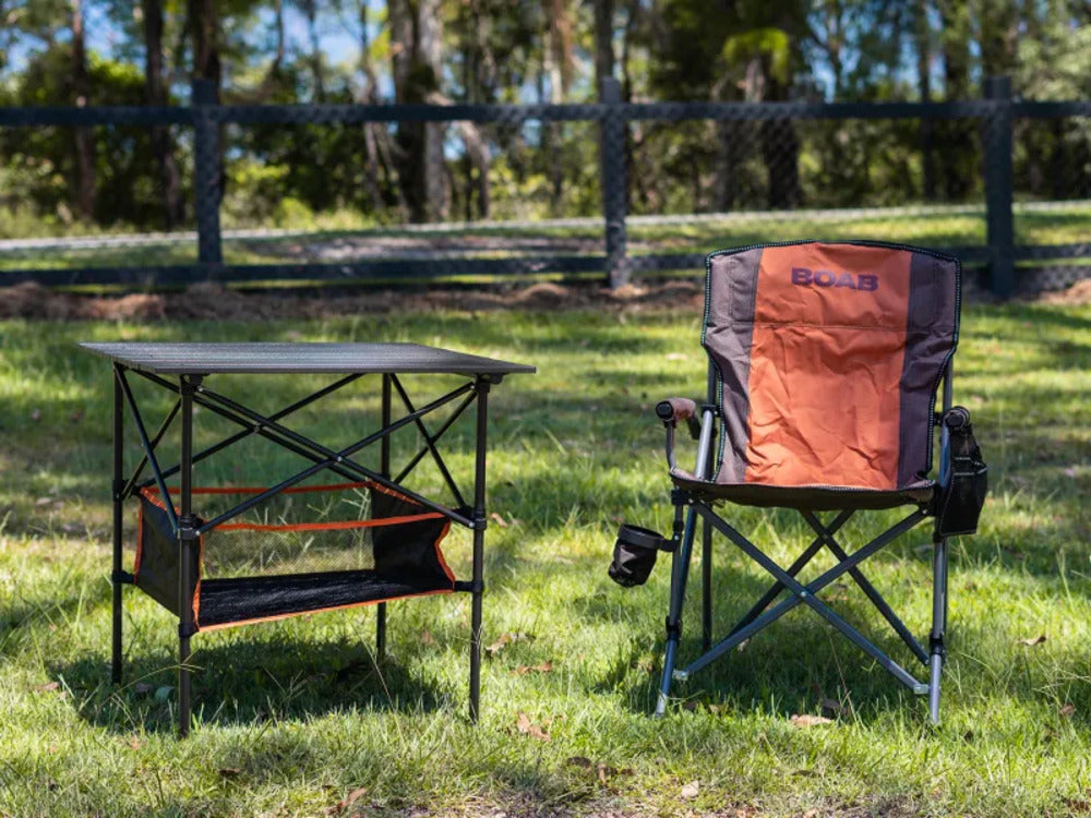 BOAB Camping Table Next To A Foldable Chair