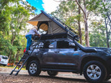 Person Climbing Inside the BOAB Hard Shell Roof Top Tent