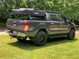 Rooftop tent mounted on tub rack on mitsubihsi triton