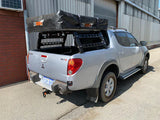 Mitsubishi triton with tub rack mounted and rooftop tent