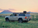 the slimline 2 roof rack by front runner for a toyota tacoma 2005-current in action