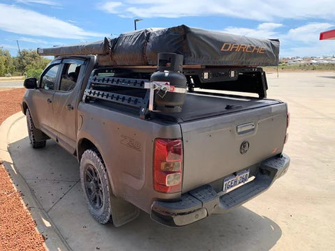 ozroo tub rack and cover mounted on a truck with a roof top tent