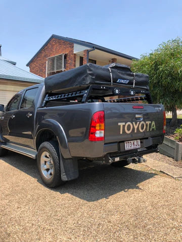 Ozroo tub rack by ppd performance mounted on toyota hilux with rooftop tent