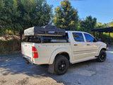 Side view of ozroo tub rack with rooftop tent mounted on toyota hilux