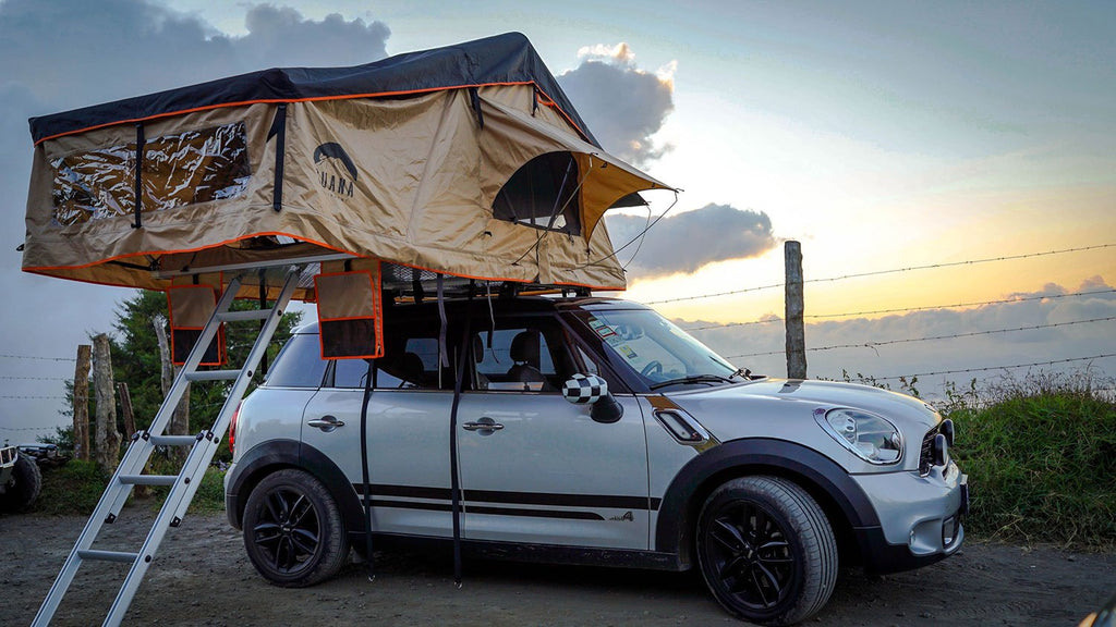 Guana Equipment Wanaka Roof Top Tent With XL Annex on top of a mini cooper